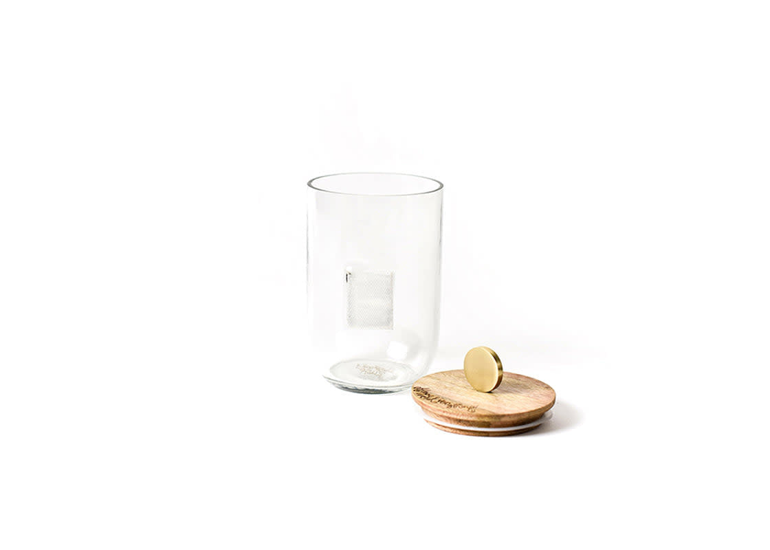 Small mini glass jar with mango wood lid featuring a metal knob.