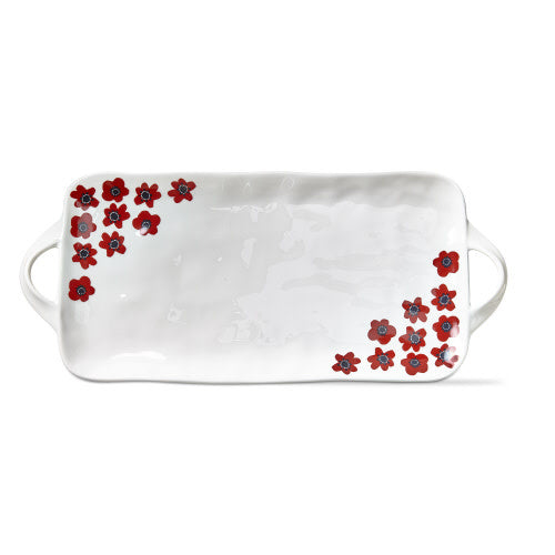 Rectangular earthenware platter with a happy flower pattern in warm tones.