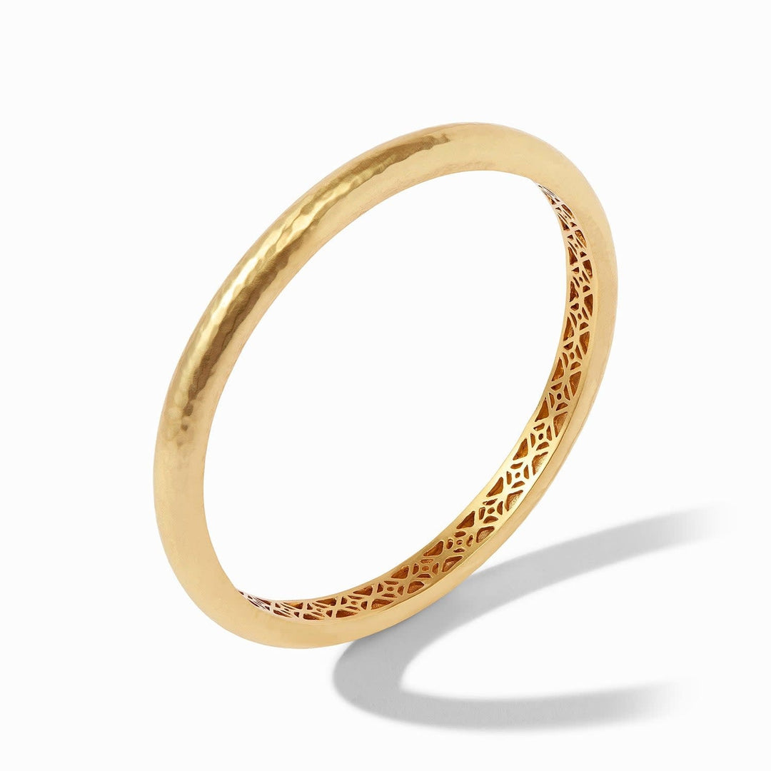 Gold Havana bangle with hand-hammered finish and geometric piercework interior.