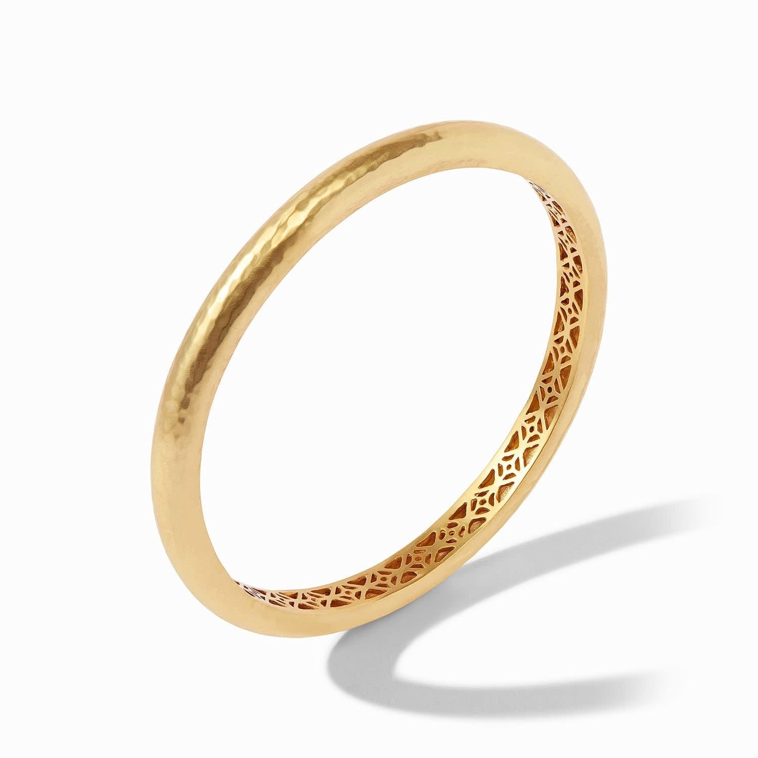 Gold Havana bangle with hand-hammered finish and geometric piercework interior.