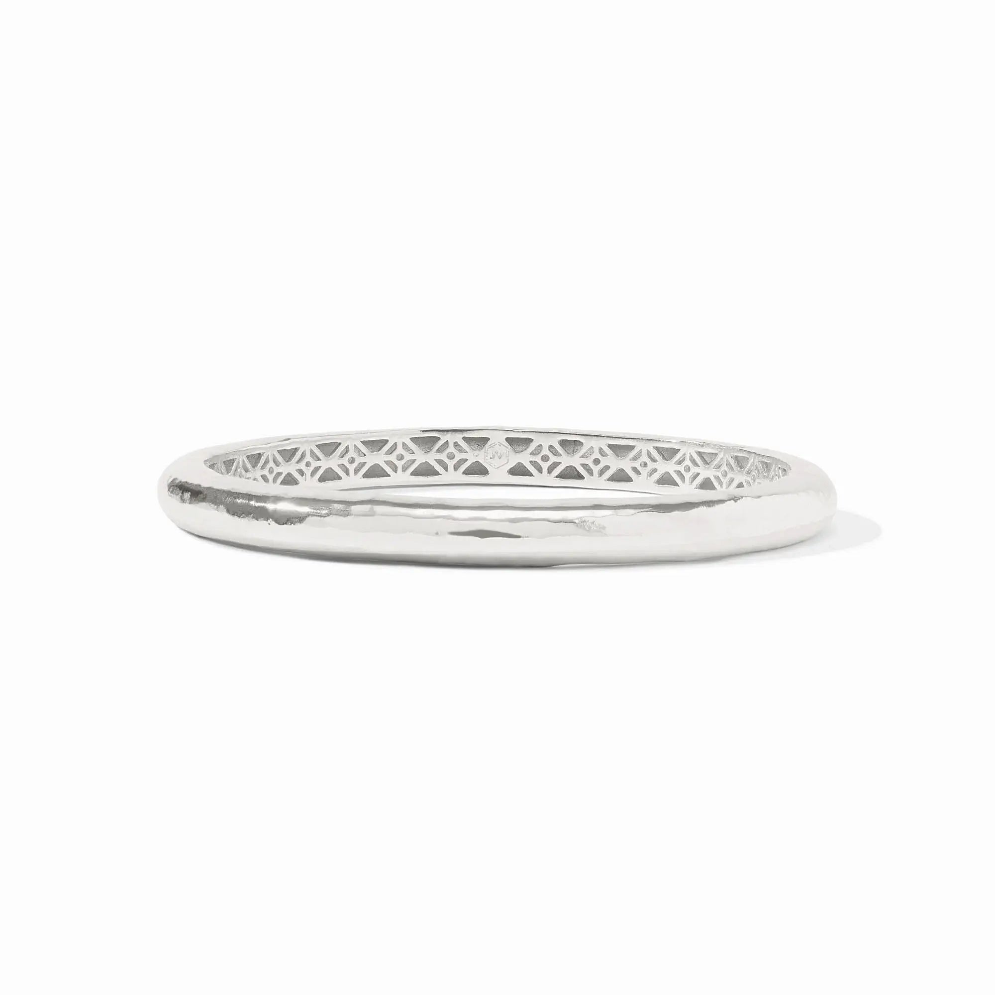 Silver Havana bangle with hand-hammered finish and geometric piercework interior.