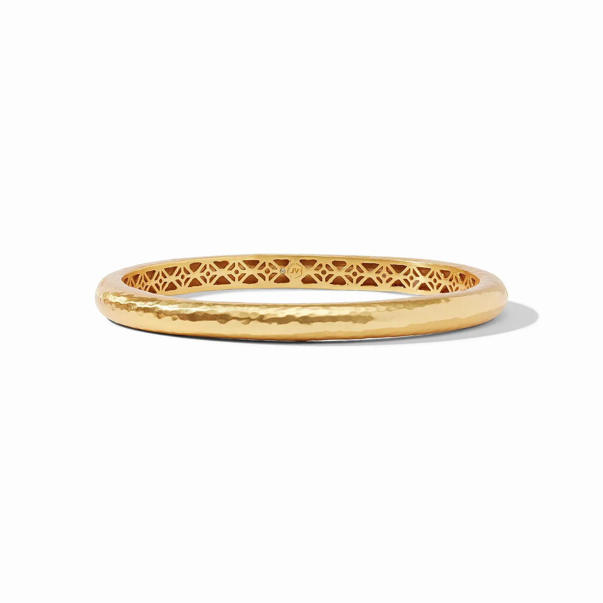 Havana bangle in gold with hand-hammered finish and geometric piercework interior.