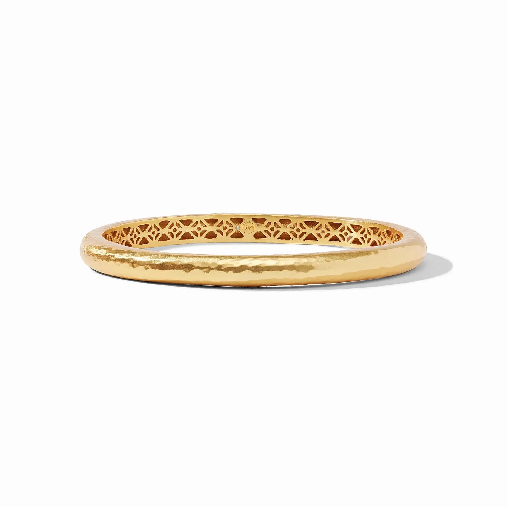Havana bangle in gold with hand-hammered finish and geometric piercework interior.