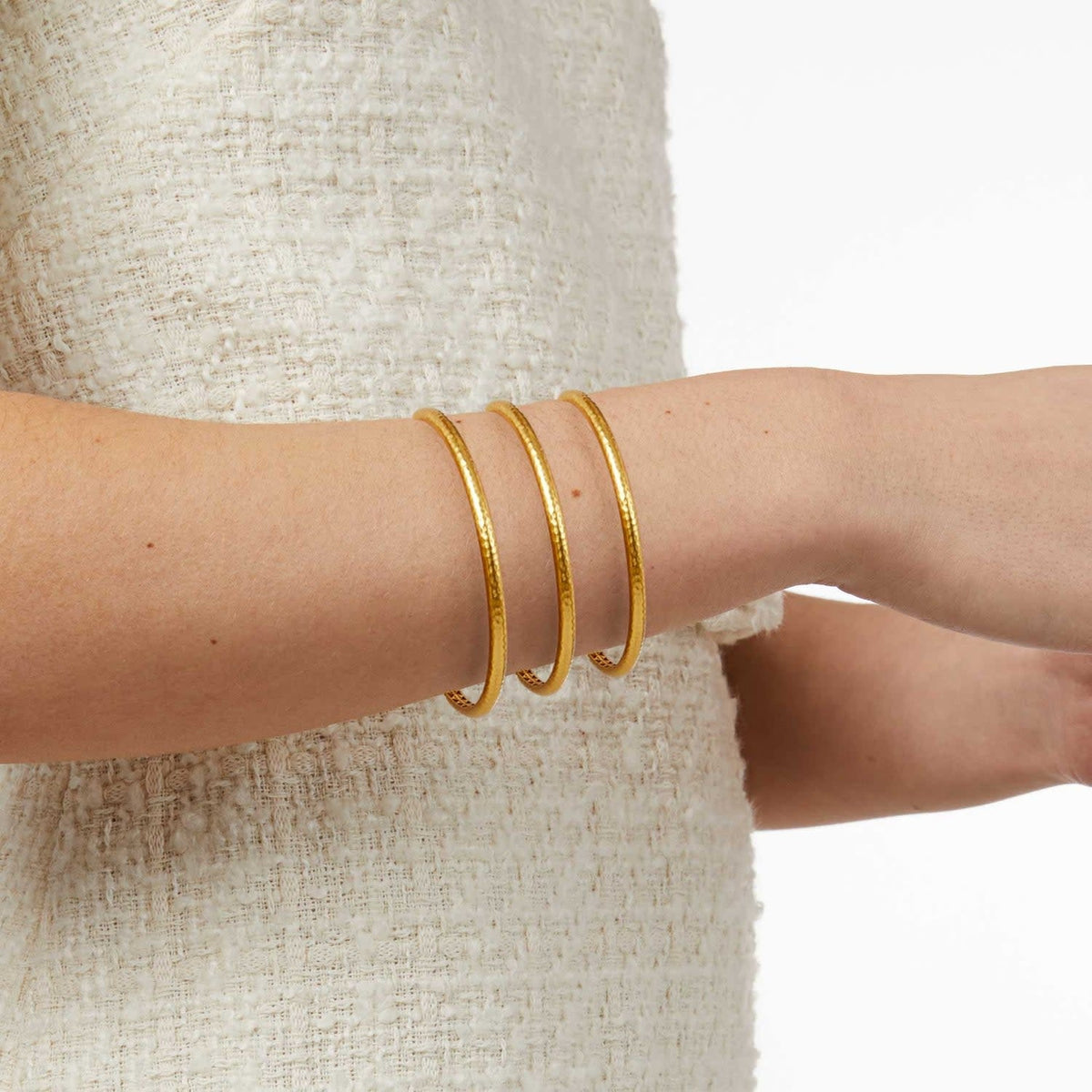 Gold Havana Demi Bangle with hand-hammered finish and geometric bas relief interior.