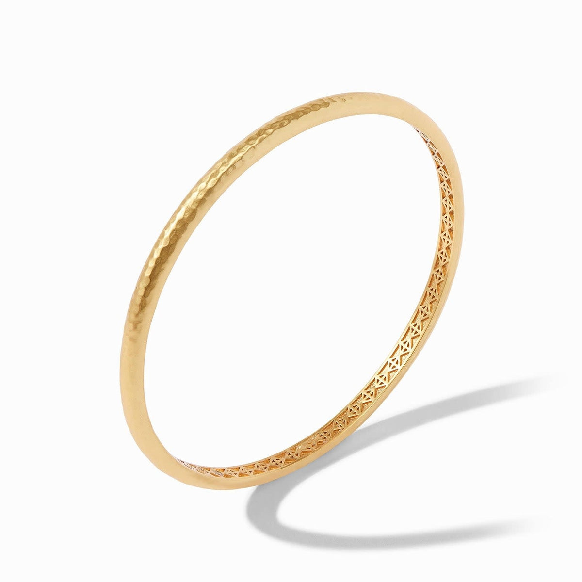 Gold Havana Demi bangle with a slim hammered finish and geometric bas relief interior.
