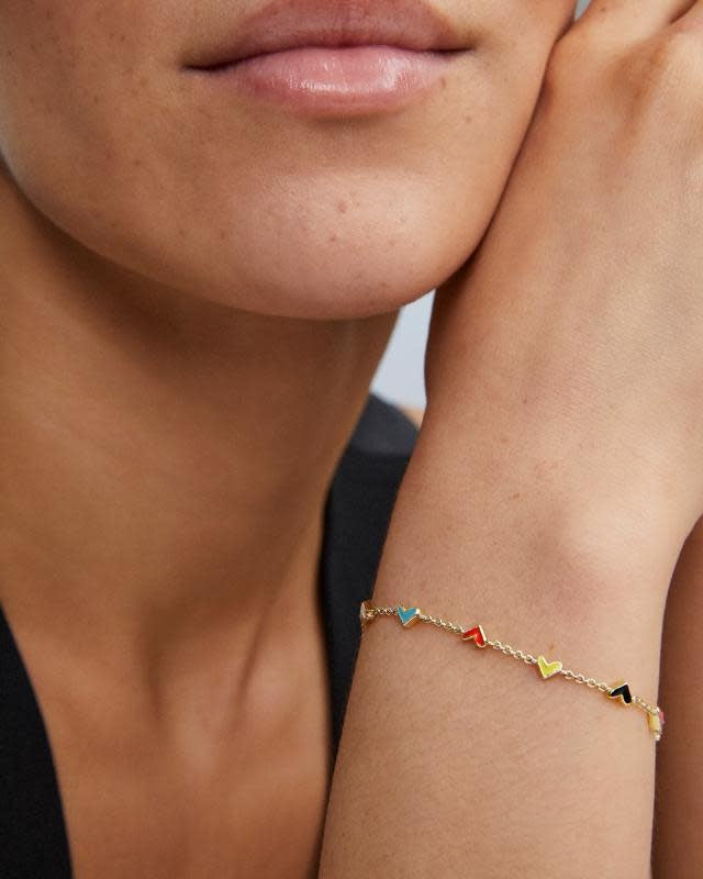 Gold chain bracelet with lobster clasp featuring hand-painted hearts in aqua, yellow, pink, red, black, and white enamel.
