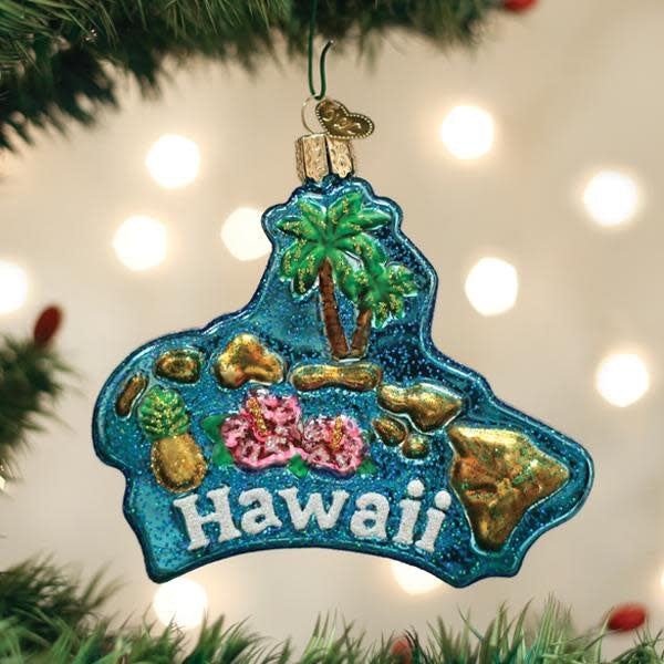 Hawaiian Islands ornament featuring a tropical palm tree silhouette on a white ceramic base with blue ocean and sky details.