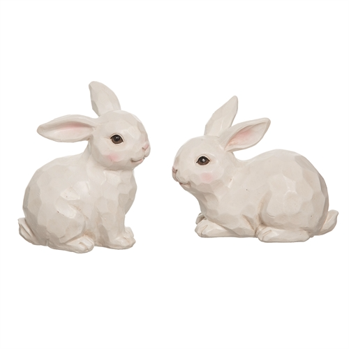 White sculpted bunny figurine with a large upright silhouette.
