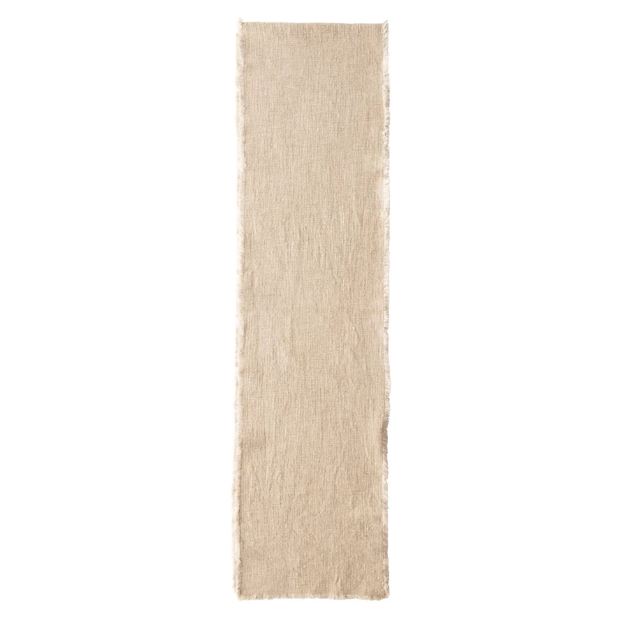 Long beige linen blend table runner with frayed edges on a white background.