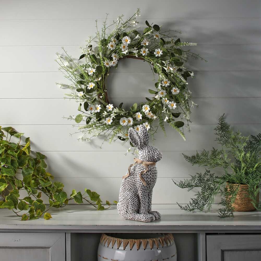 Woven resin rabbit figurine with a natural textured finish