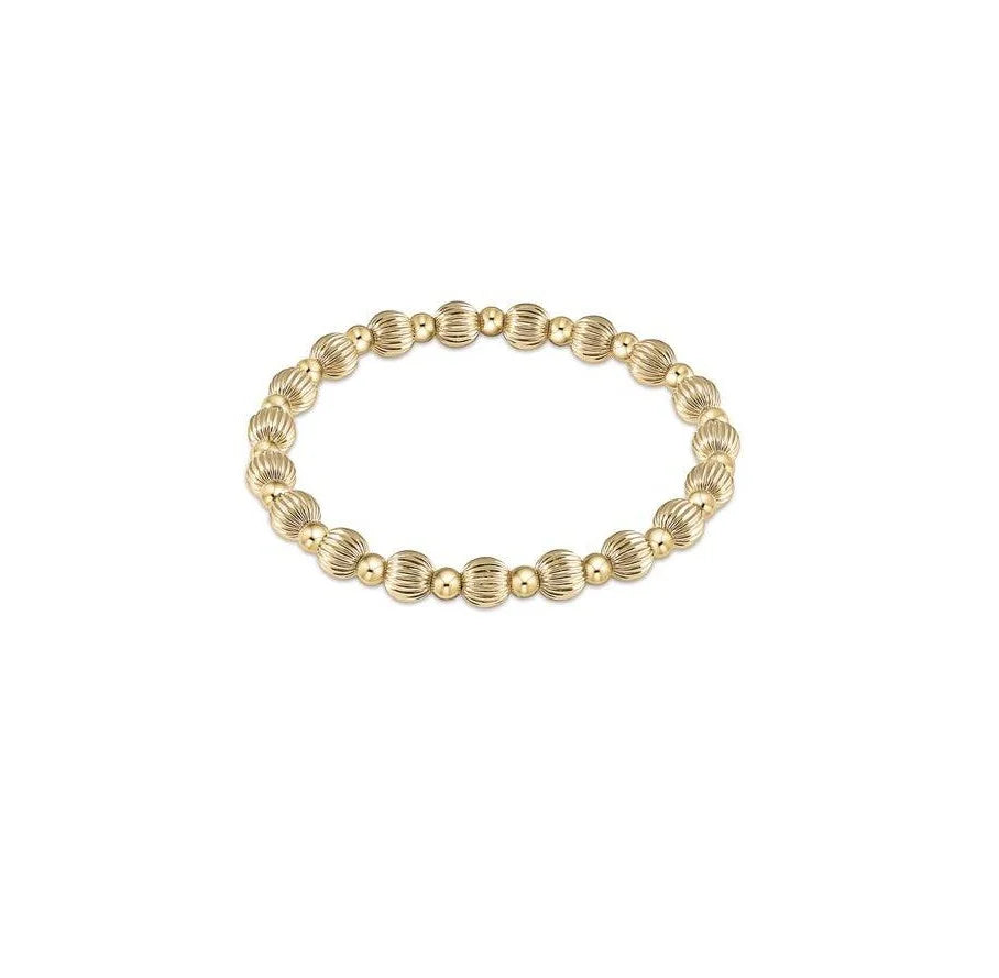 Gold beaded bracelet with a Dignity Grateful pattern on high-performance elastic.