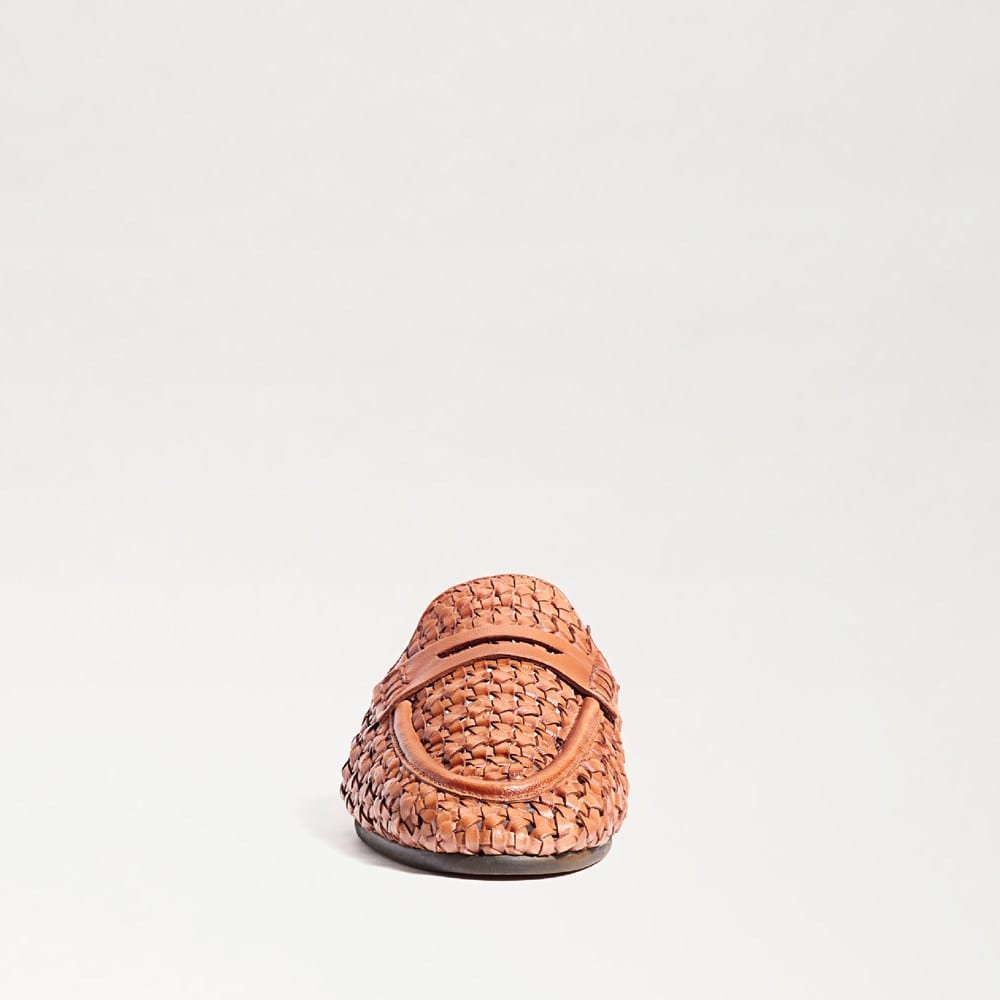 Front view of a Tullie Woven Mule in tan leather with an almond toe and flat sole.