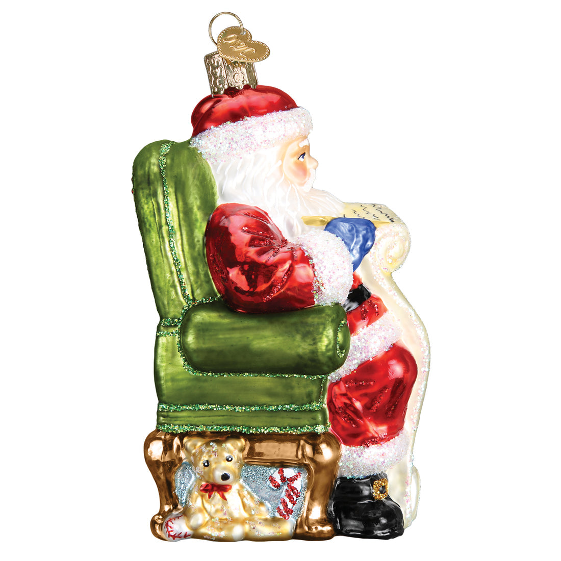 Glass Santa ornament sitting in a green chair checking his list with a teddy bear underneath.