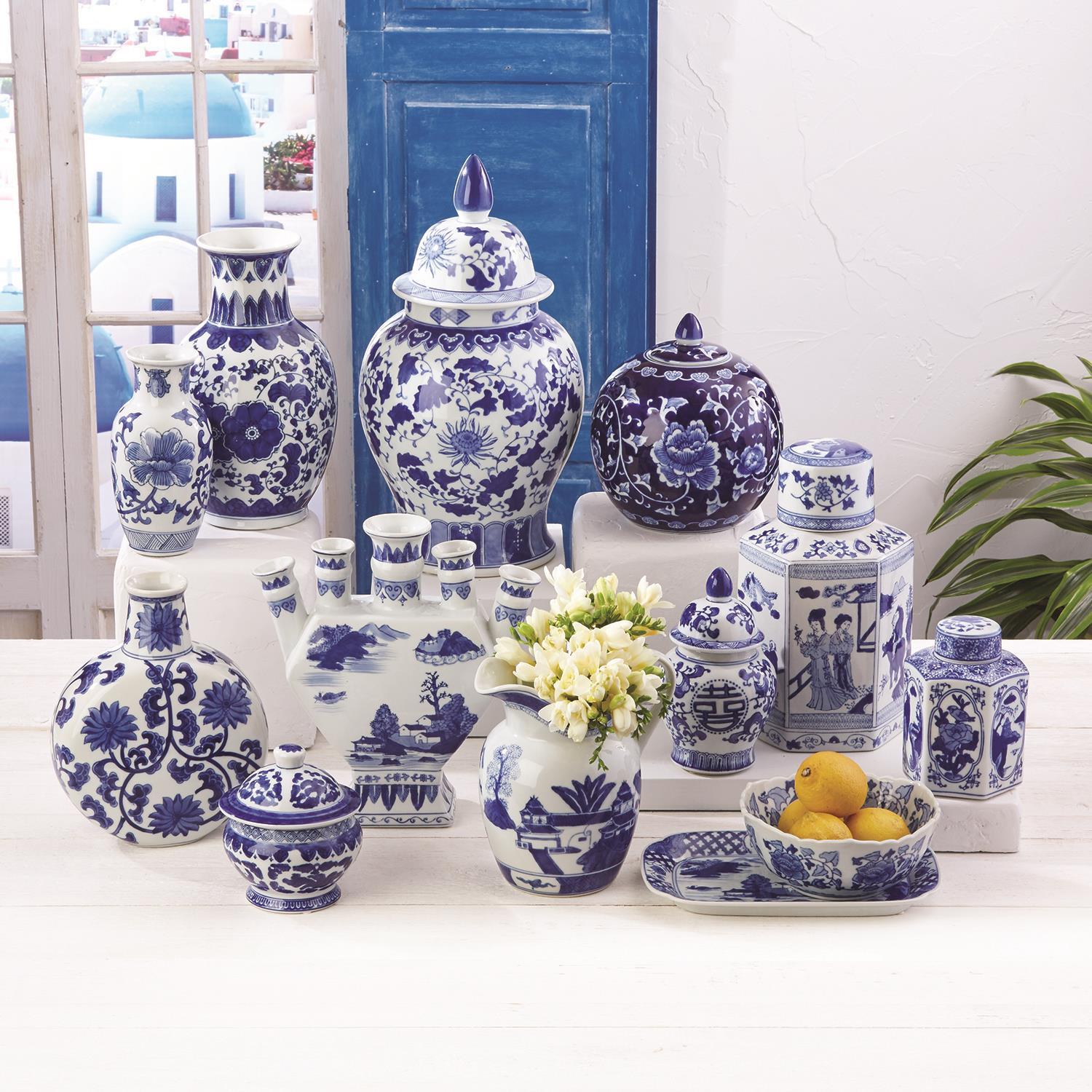 Collection of blue and white Canton ceramic vases, jars, and bowls in traditional patterns.