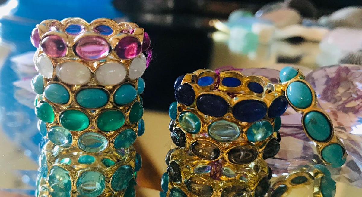 Continuous Gemstone ring with a sleek band featuring an unbroken row of colorful gemstones in a timeless setting.