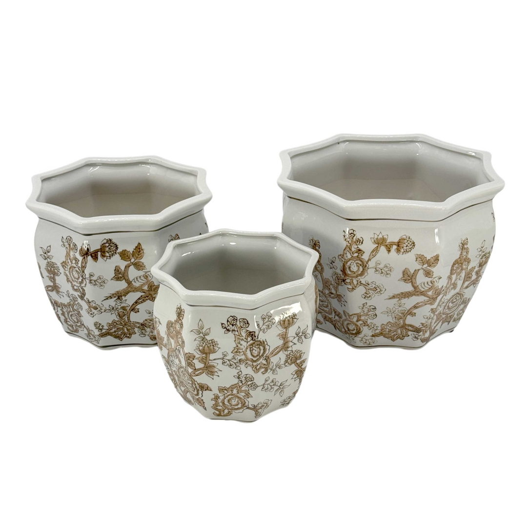 Three octagonal ceramic planters with brown floral chinoiserie patterns on a white background.