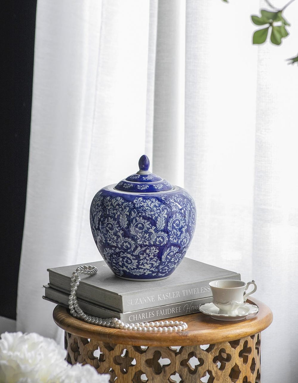 Round porcelain ginger jar in blue and white with a matching lid