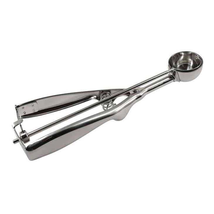 Stainless steel cookie dough scoop with a spring-loaded handle and a round bowl.