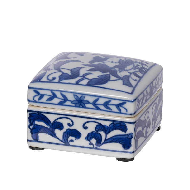Set of three porcelain decorative boxes with intricate blue and white patterns.