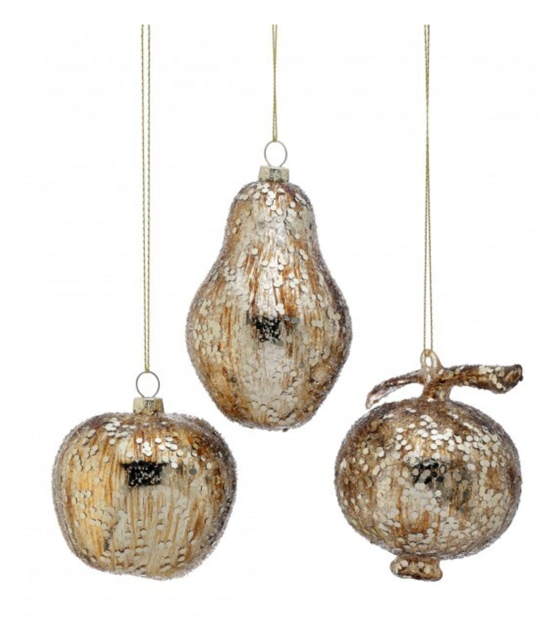 Set of three 4.5-inch glass apple, pear, and pomegranate ornaments in metallic champagne gold.