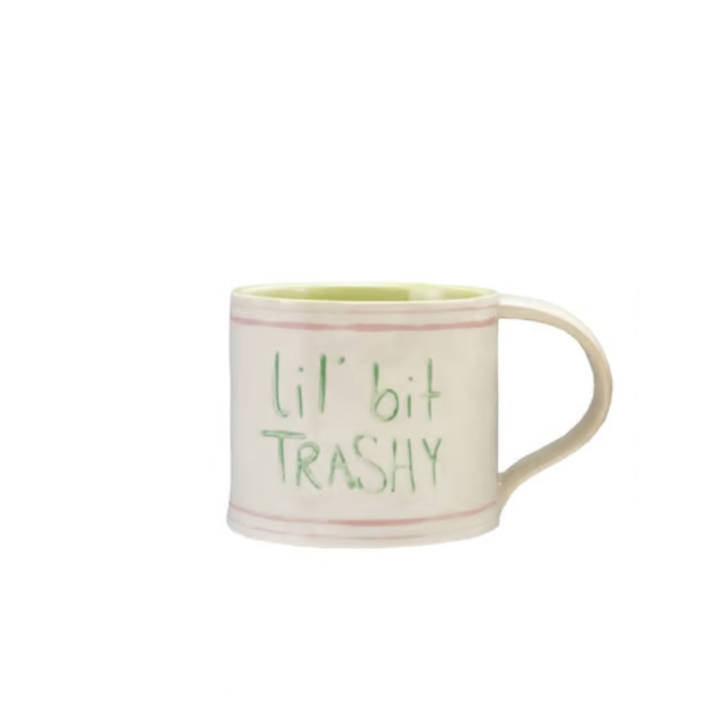 Hand-painted stoneware mug with pink stripes and green text reading lil' bit TRASHY.
