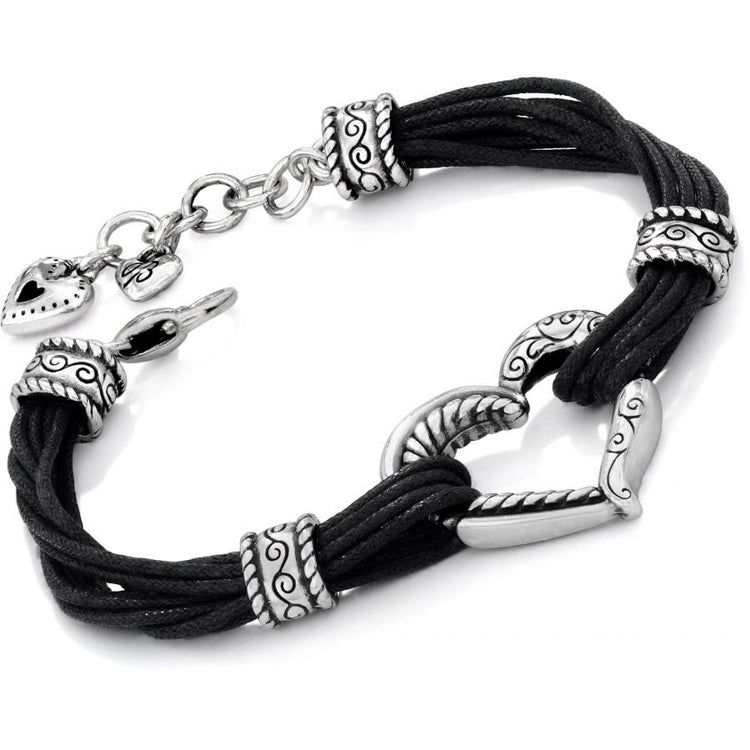 Adjustable silver-plated cotton cord bracelet featuring a black heritage heart pendant.