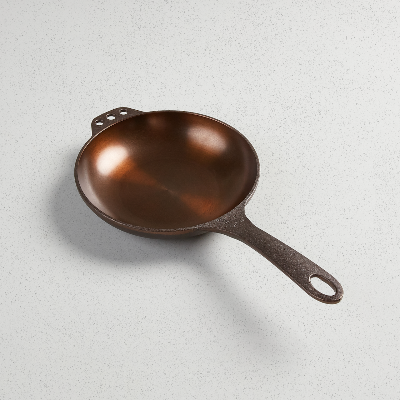 No. 8 Chef Skillet with satin-smooth polished finish and extended length handle featuring hanging holes on both sides.