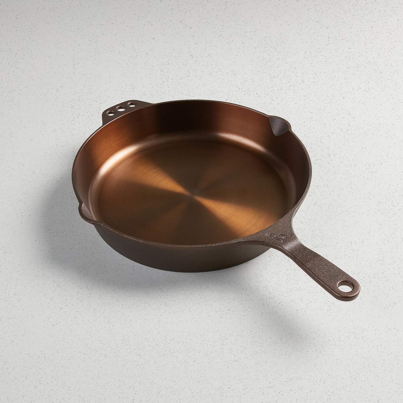 No. 12 Traditional skillet with polished interior finish, ergonomic handle, pour spouts, and hanging holes.