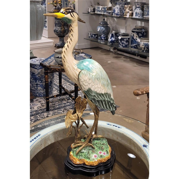 Bronze-accented heron sculpture with natural elegance