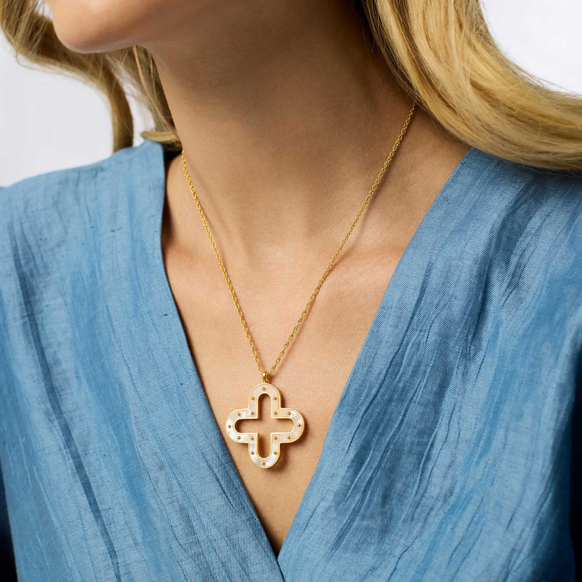 Adjustable Colette necklace featuring a mother-of-pearl pendant on an 18 to 20-inch gold-plated chain.