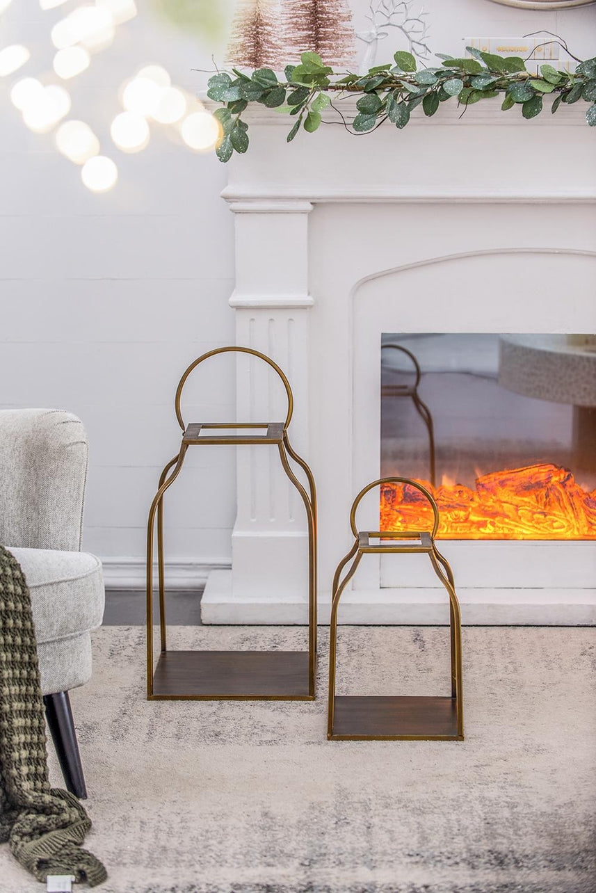 Antique gold iron lantern with a simple rectangular frame and clear glass panels.