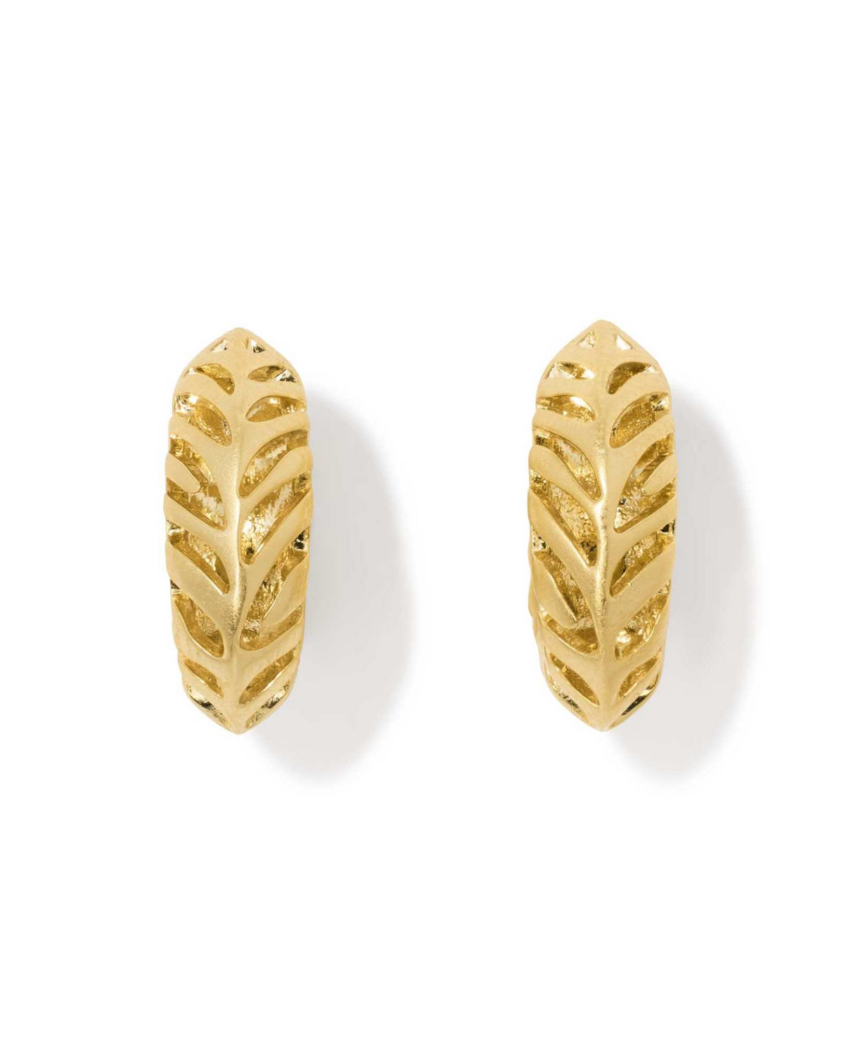 Tiger Striped Mikki gold huggie earrings with textured cutout leaf-like patterns.