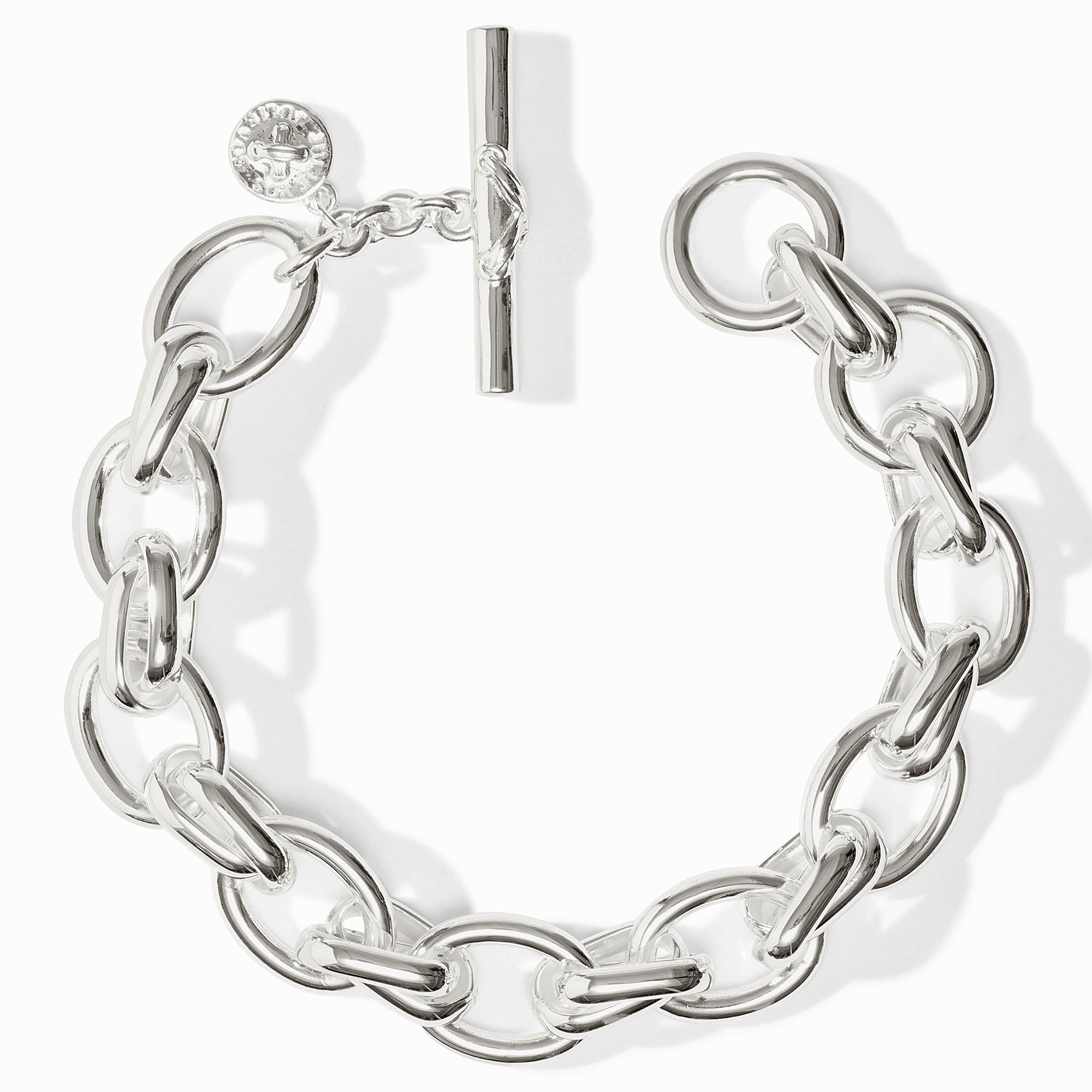 Silver Essex Link Bracelet with a toggle clasp and a small round charm.