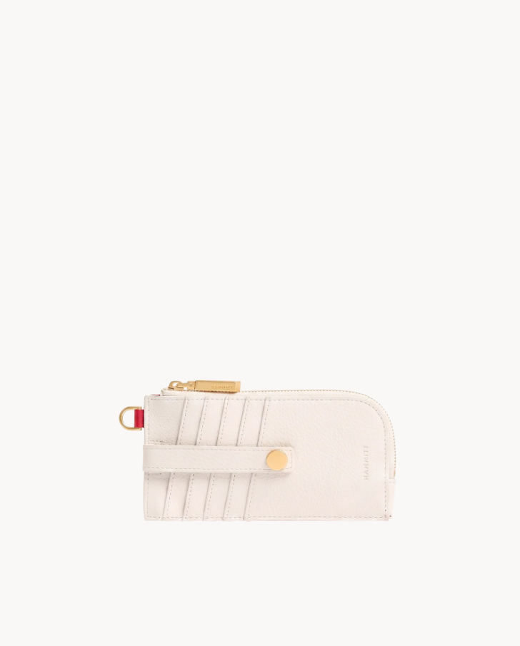 White pebbled leather 210 East wallet with diagonal card slots, gold hardware, and a D-ring.