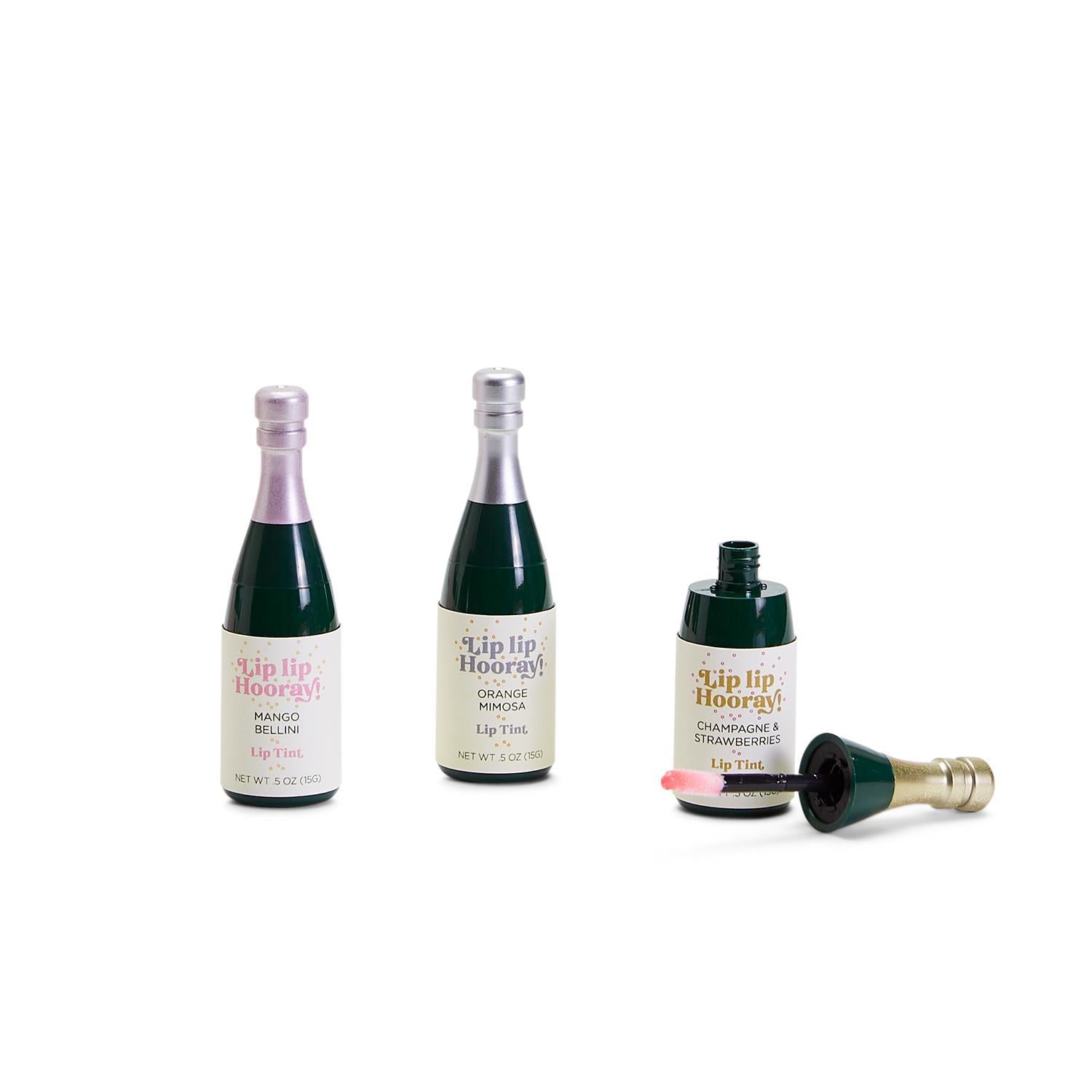 Champagne Bottle Lip Gloss in a clear container with tapered applicator.