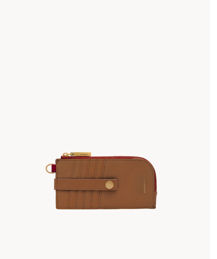 Tan brown pebbled leather 210 East Wallet with brushed gold hardware and red zipper detail.
