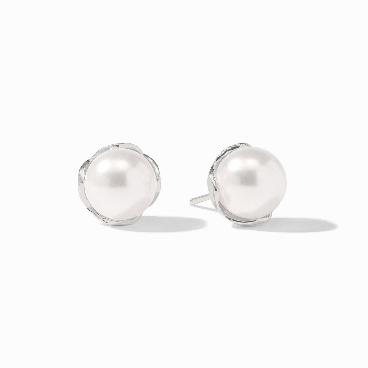 Penelope silver stud earrings featuring round white glass pearls in a polished silver-plated setting