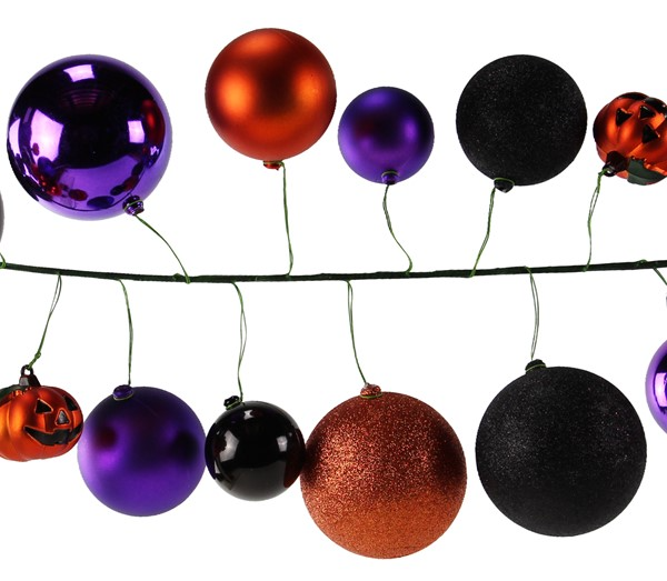 Halloween ornament garland with miniature jack-o-lanterns in purple, orange, and black shiny, matte, and glitter finishes.
