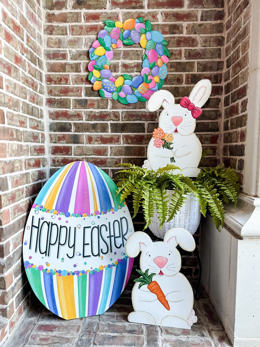 Colorful Happy Easter egg yard stake with floral patterns in red, yellow, blue, and green.