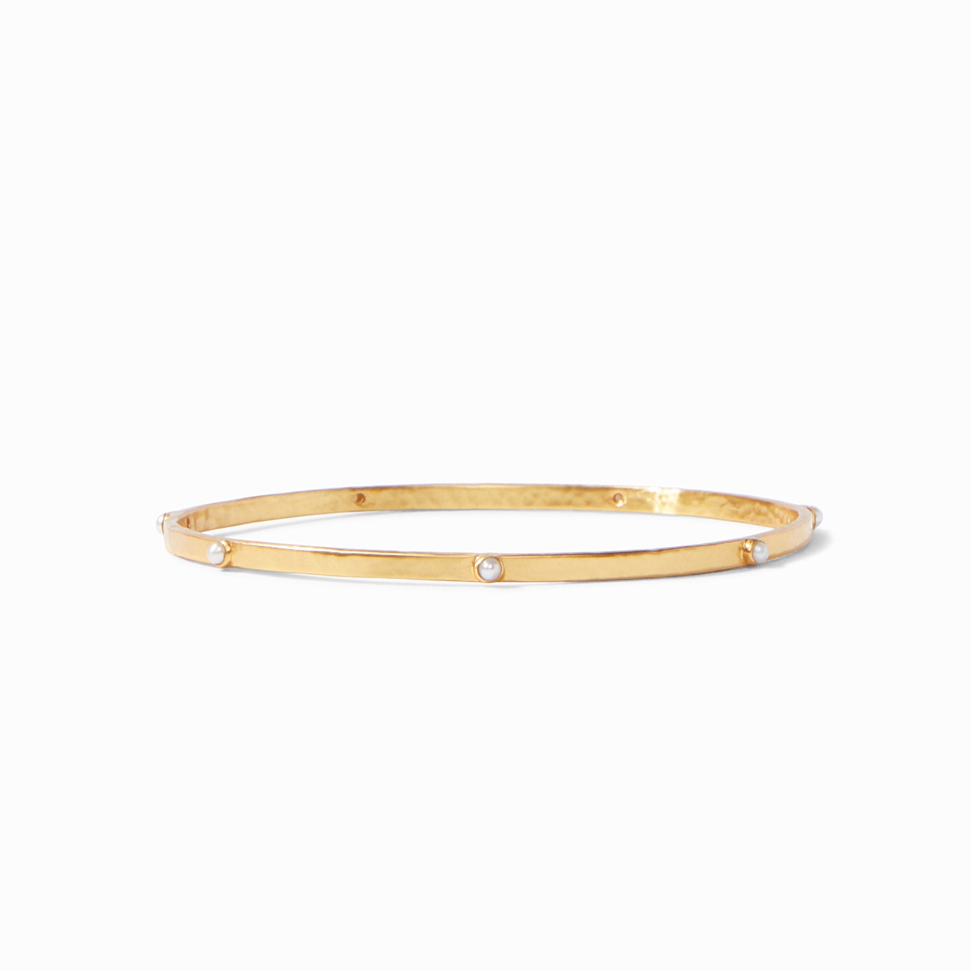 Lightly hammered gold bangle with gemstone stations