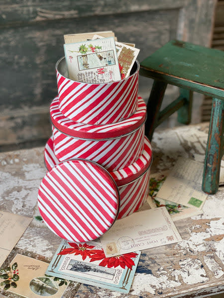 Peppermint striped tin with a mint green lid featuring white diagonal stripes.