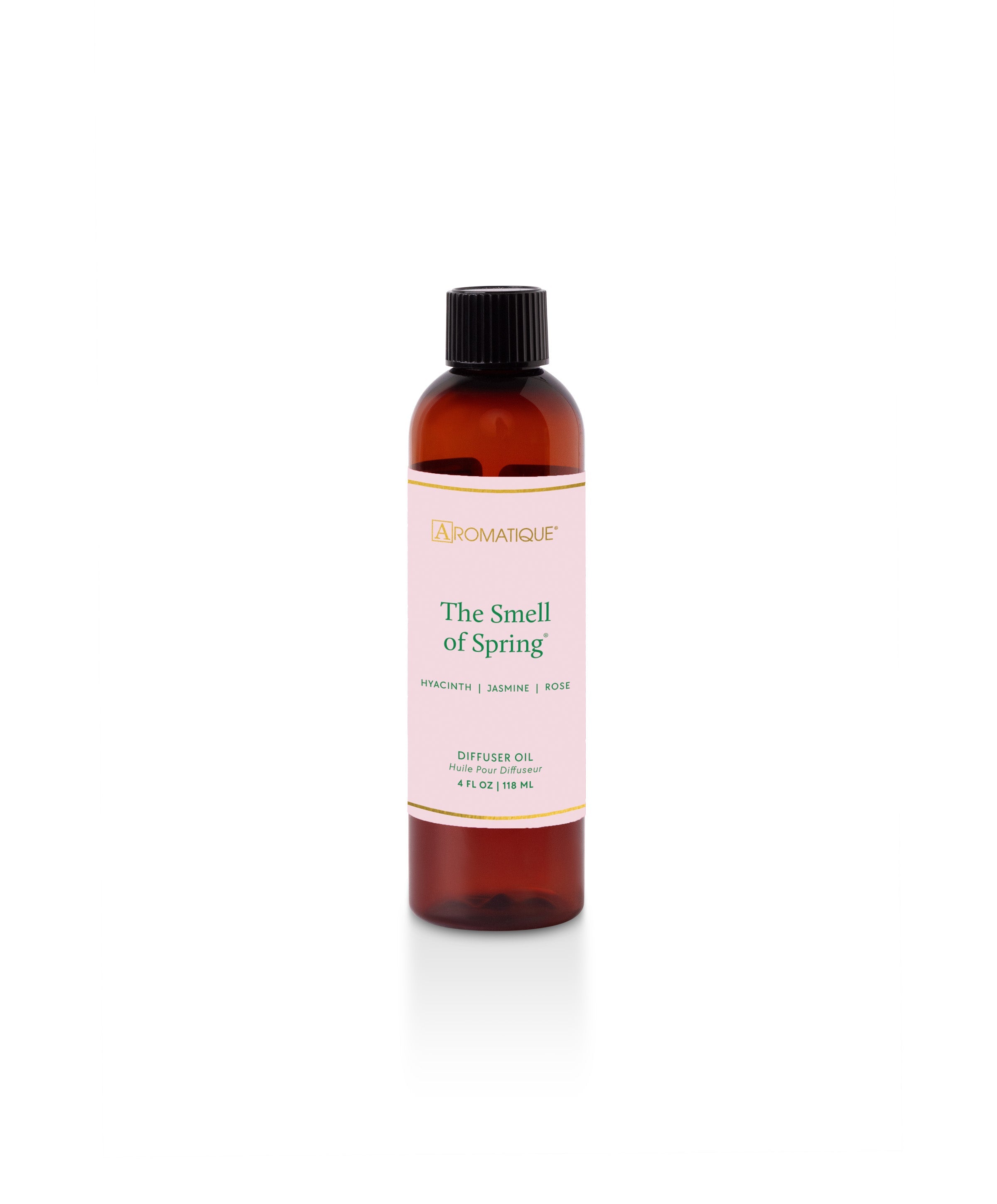 Glass diffuser bottle with reeds filled with spring-scented oil featuring pineapple and floral notes.