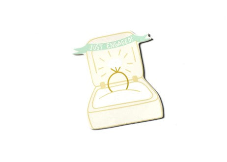 A ring box with a gold ring inside and a banner that says "JUST ENGAGED!"