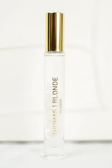 High-Roller unisex perfume stick with a silver metallic body and black cap.