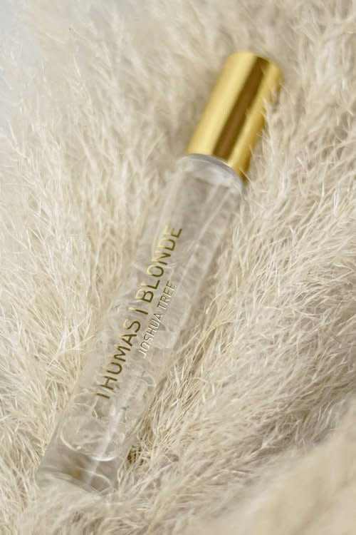 High-Roller unisex perfume stick in Joshua Tree scent with a roll-on applicator and natural wood finish.