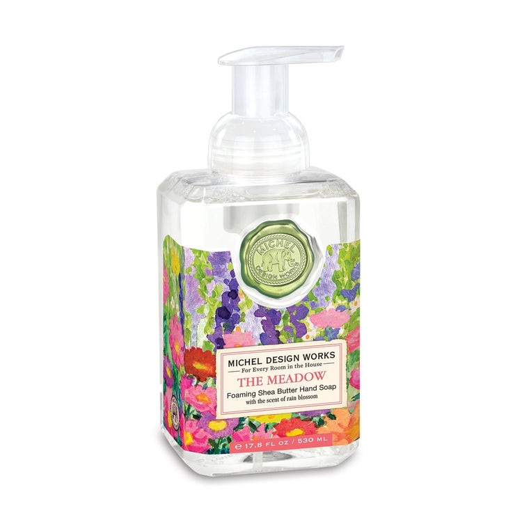 Spring Foaming Soap bottle with light blue liquid inside.