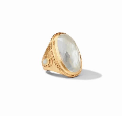 Cannes Statement Ring in gold with a large faceted clear glass stone and mother of pearl accents.
