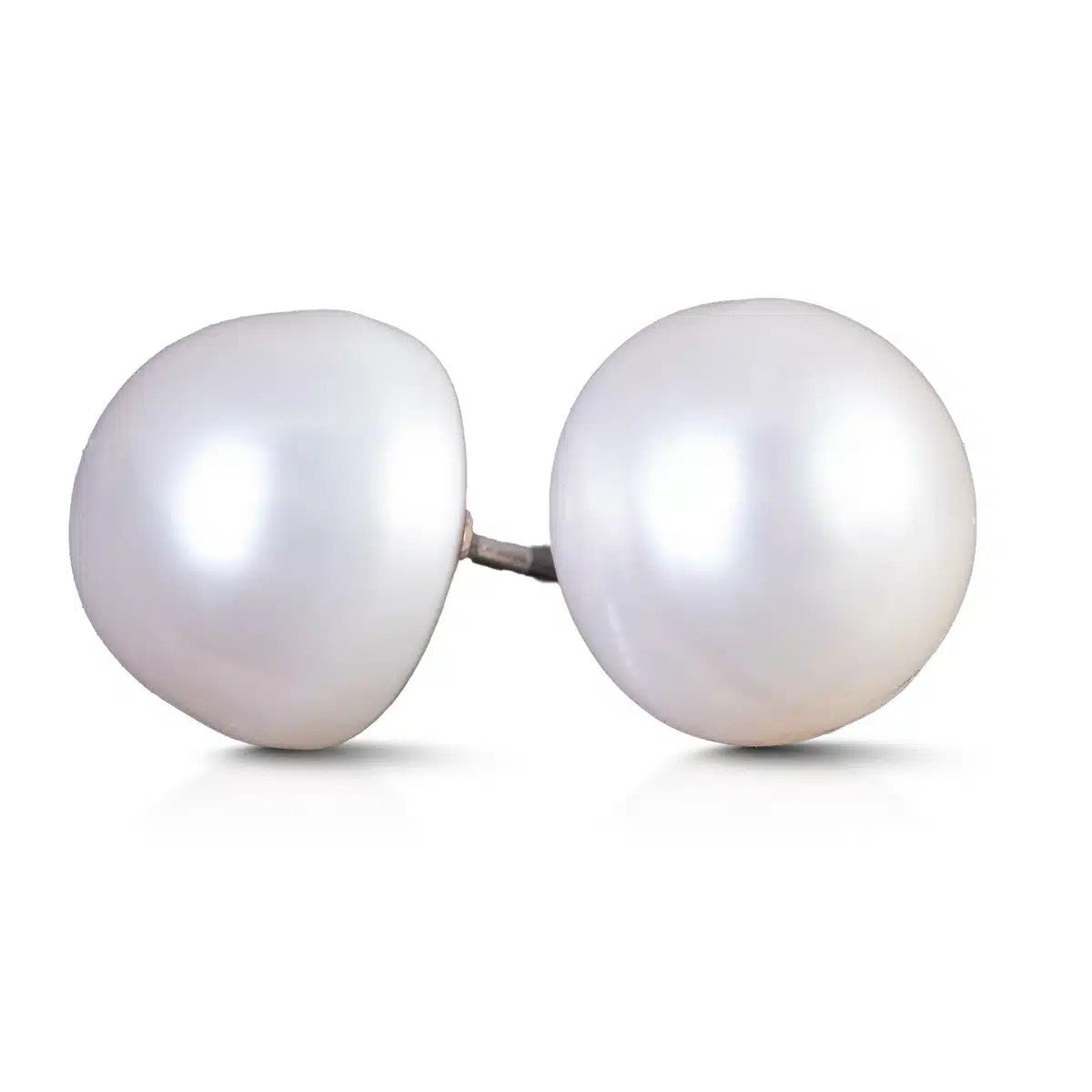 A pair of natural white button-shaped pearl stud earrings with silver posts.