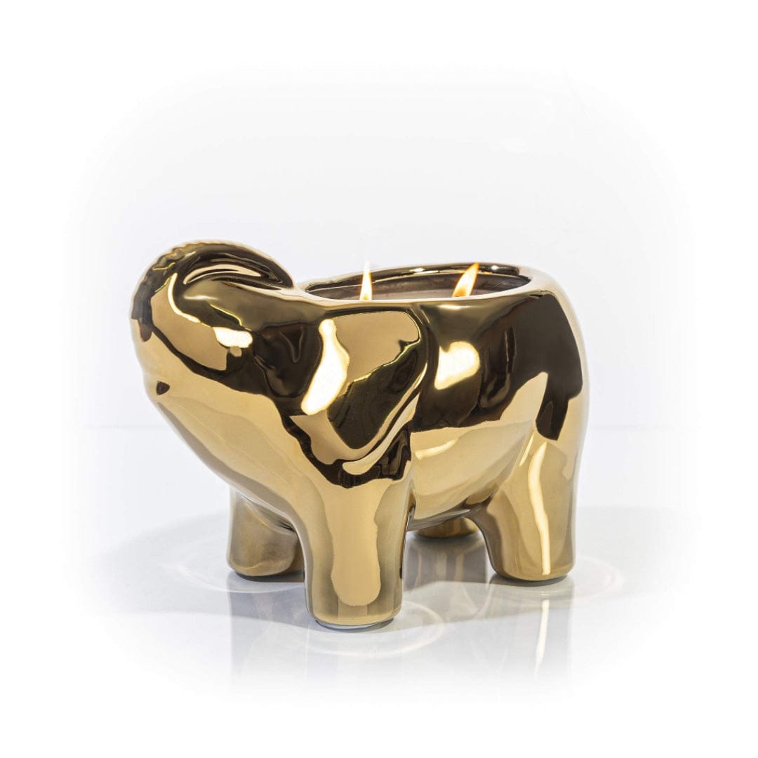 Gold elephant-shaped candle with a smooth metallic finish.