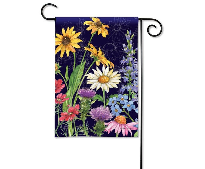 Garden flag with a dark blue background featuring a watercolor painting of various wildflowers including sunflowers, daisies, and thistles.